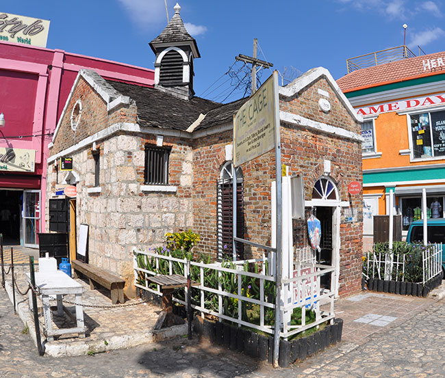 Historic Building "The Cage" which served as a jail is located across from the Sam Sharpe monument in the square — still standing as a memorial to our past
