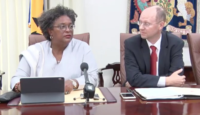 Prime Minister Mia Mottley (left) and IMF’s head of mission to Barbados, Bert Van Selm during today’s press conference.Giving the stamp of approval for the 2019/2020 budget measures, Van Selm said broadening the tax base of the Value Added Tax (VAT) and land tax would help support Government revenue.