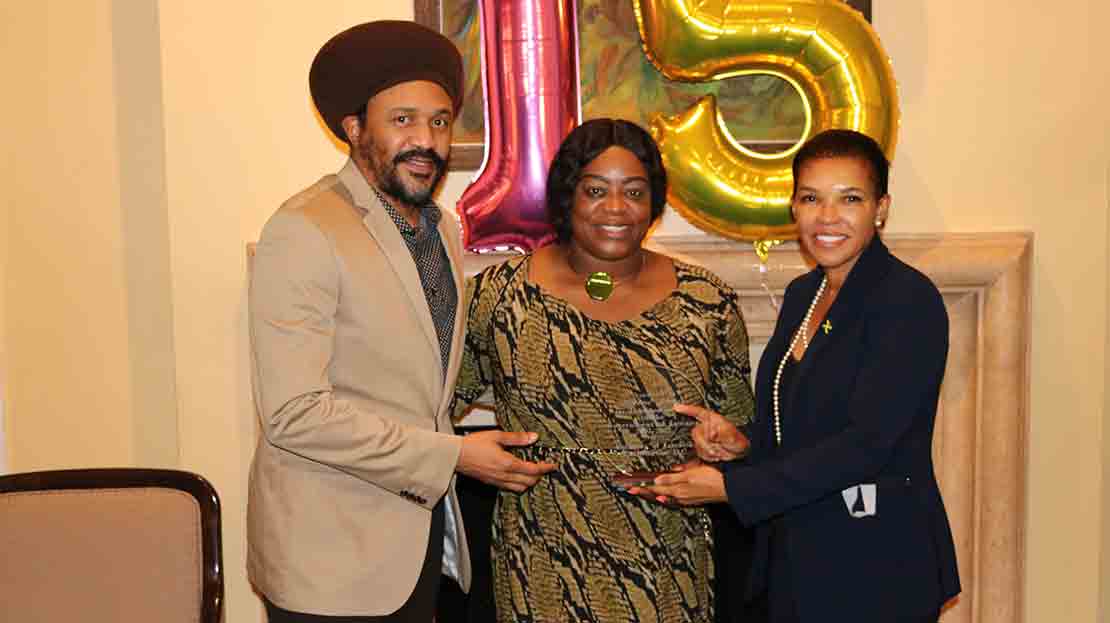 Jamaica’s Ambassador to the United States Audrey Marks presents a token of appreciation to Mrs Shereen James Phillpotts. Sharing in the occasion is her husband Mr. Wolde Phillpotts (Photo Derrick Scott)