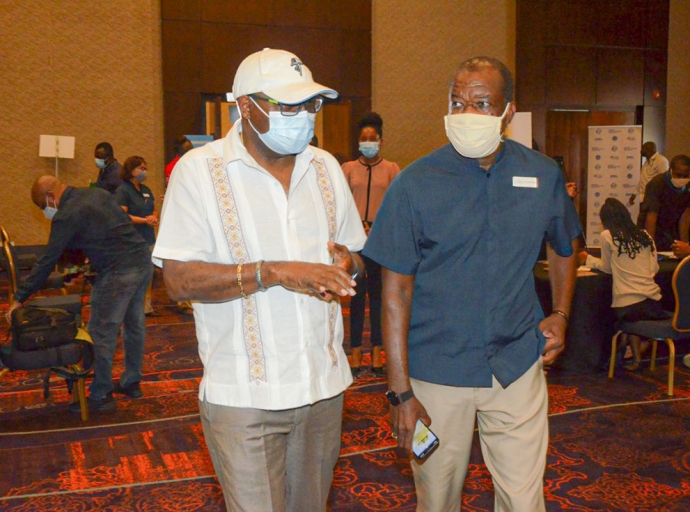 Minister of Tourism, Hon. Edmund Bartlett (left) and President of the Jamaica Hotel and Tourist Association (JHTA), Clifton Reader, are in conversation at the Tourism Vaccination Task Force’s COVID-19 vaccination blitz held at Moon Palace in Ocho Rios, St. Ann, on Friday, September 3. 