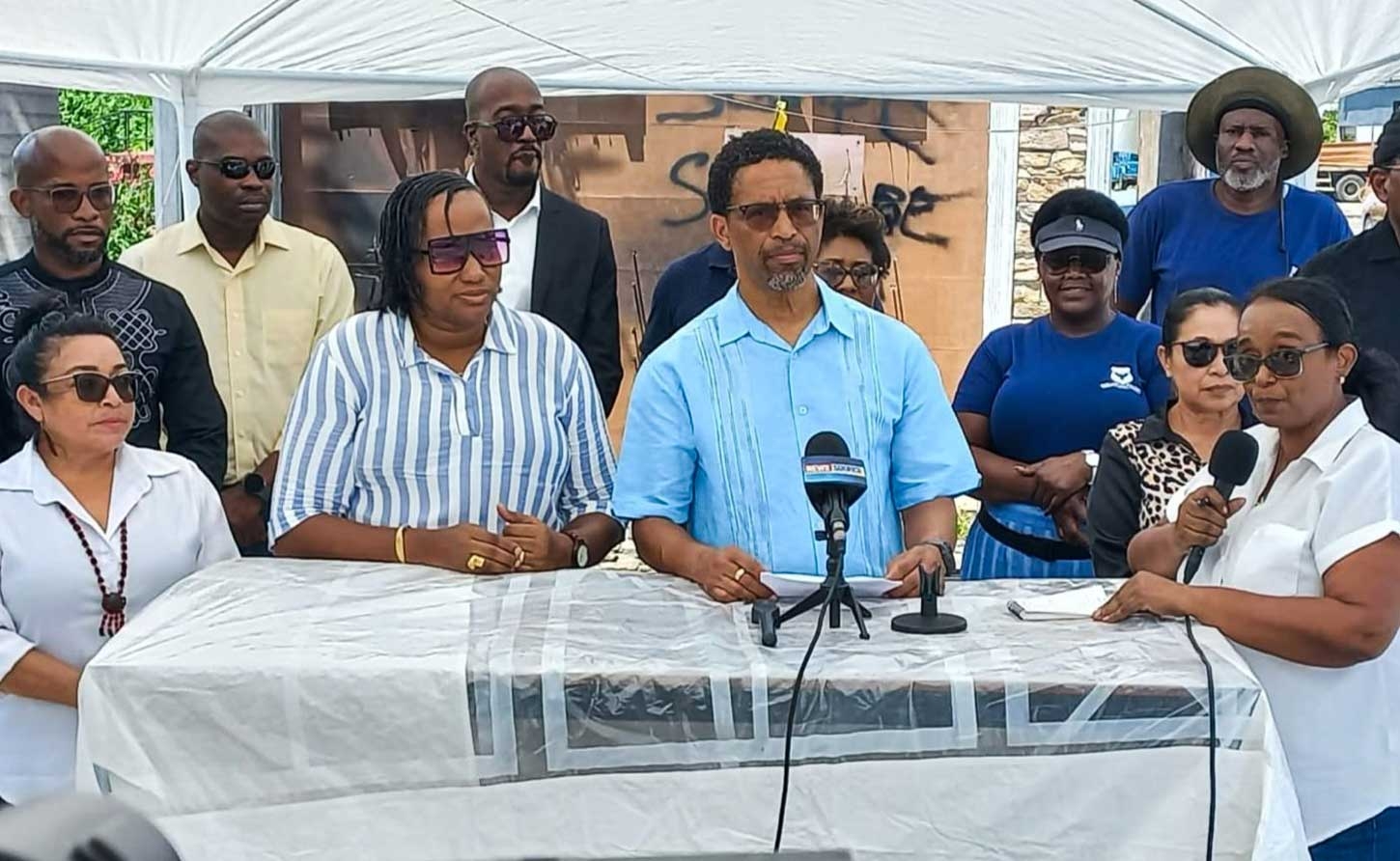 Dr. Terrence Campbell, delivering a statement at the press conference on Wednesday.