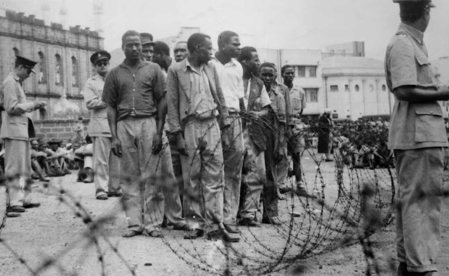 Mau Mau suspects are rounded up by police outside a camp in Manyani, Kenya in 1955. Archive Photos/Getty Images