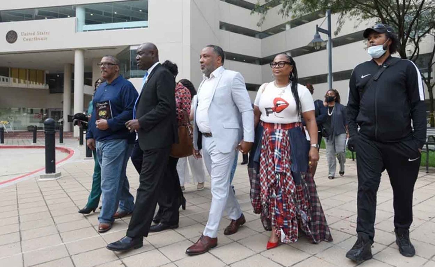 Attorney Ben Crump, second from left, walks with Ron Lacks, left, Alfred Lacks Carter, third from left, both grandsons of Henrietta Lacks, and other descendants of Lacks, outside the federal courthouse in Baltimore in 2021. Novartis settled a lawsuit with the Lacks estate this month that alleged the pharmaceutical giant unjustly profited off her cells. AP Photo/Steve Ruark, File