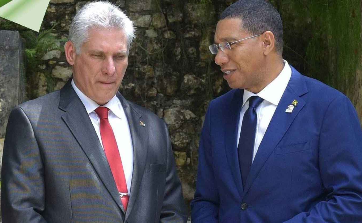 Cuban President  Miguel Díaz-Canel Bermúdez in conversation with Jamaica's Prime Minister Dr. Andrew Holnerss