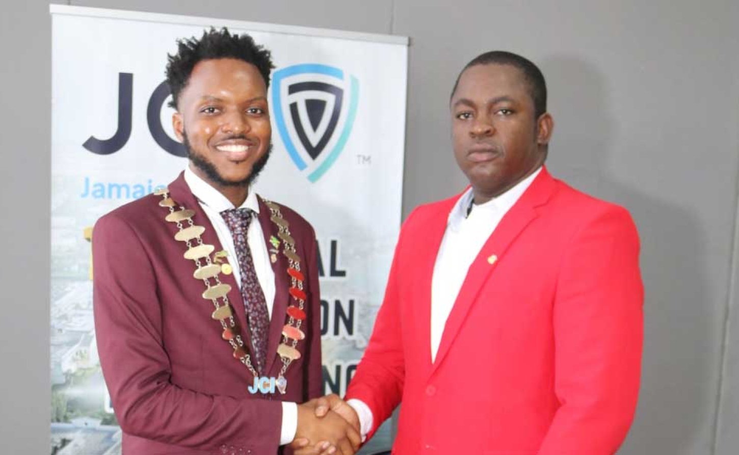 Dr. Farin Williams the newly elected National President for JCI (at right), is congratulated by outgoing President Marklon Bedward, after he was elected at JCI Jamaica’s annual convention at the Grand Palladium Resort &amp; Spa in Lucea, Hanover on Sunday, October 4.   Photo -Derrick Scott   