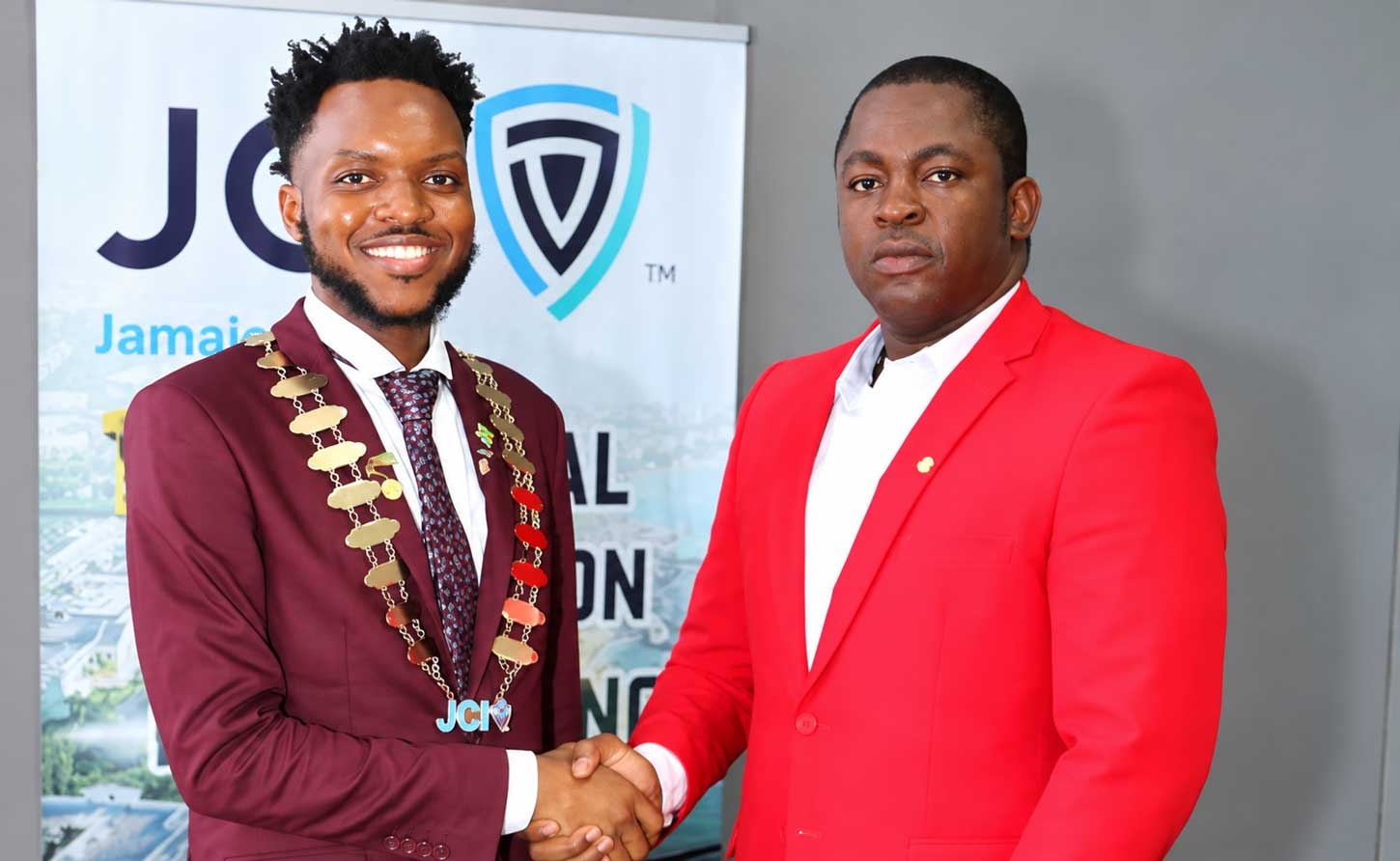 Dr. Farin Williams the newly elected National President for JCI (at right), is congratulated by outgoing President Marklon Bedward, after he was elected at JCI Jamaica’s annual convention at the Grand Palladium Resort &amp; Spa in Lucea, Hanover on Sunday, October 4.   Photo -Derrick Scott   
