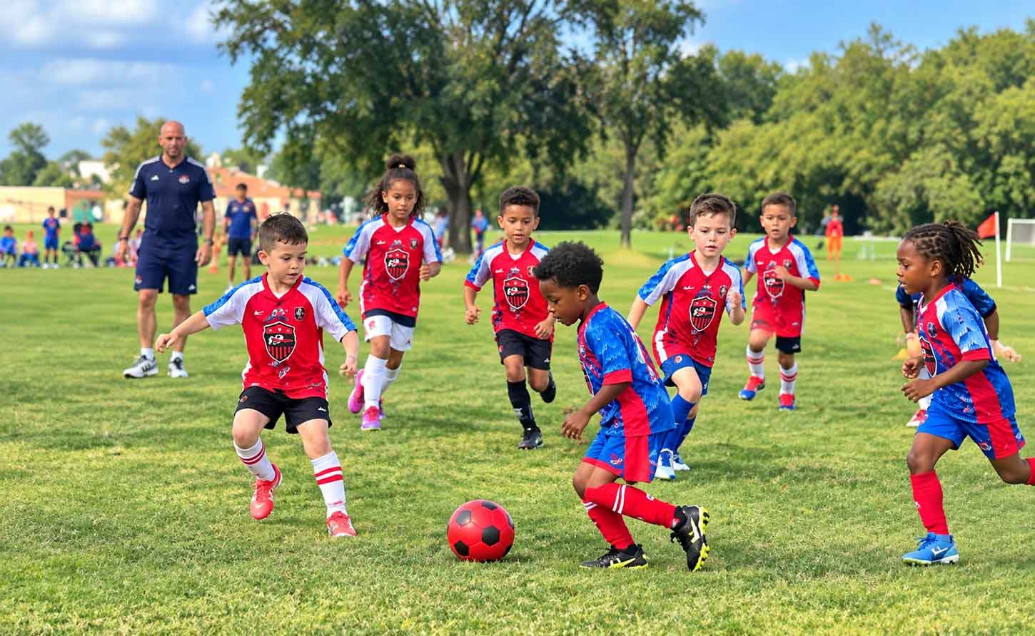 On the Ball, 3 year old Nevada Pierre on the field with the teams.