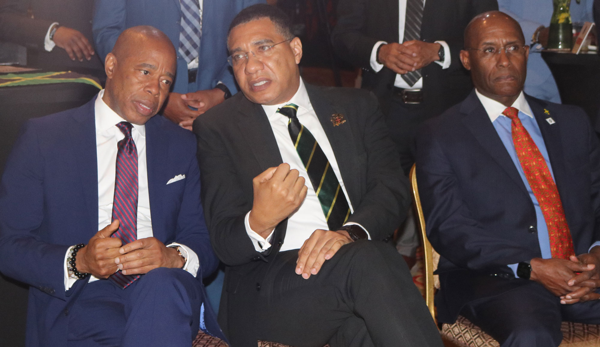 Prime Minister Andrew Holness and New York City Mayor Eric Adams exchange thoughts at the Sunday May 1, launch of Jamaica 60 Independence Anniversary Celebrations in New York. Next to the PM, Industry and Commerce Minister Aubyn Hill is engaged in the proceedings| Derrick Scott Photo