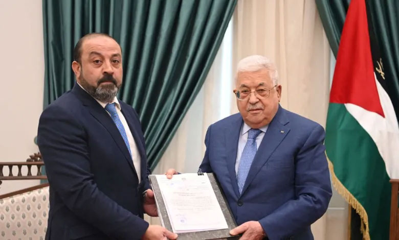 Palestinian Attorney General Akram Al-Khatib hands over the final results of the autopsy on the body of Palestinian-American Al Jazeera journalist Shirin Abu Akla to Palestinian President Mahmoud Abbas in Ramallah, in the Israeli-occupied West Bank, May 26, 2022. Palestinian President’s Office (PPO) / Handout via REUTERS
