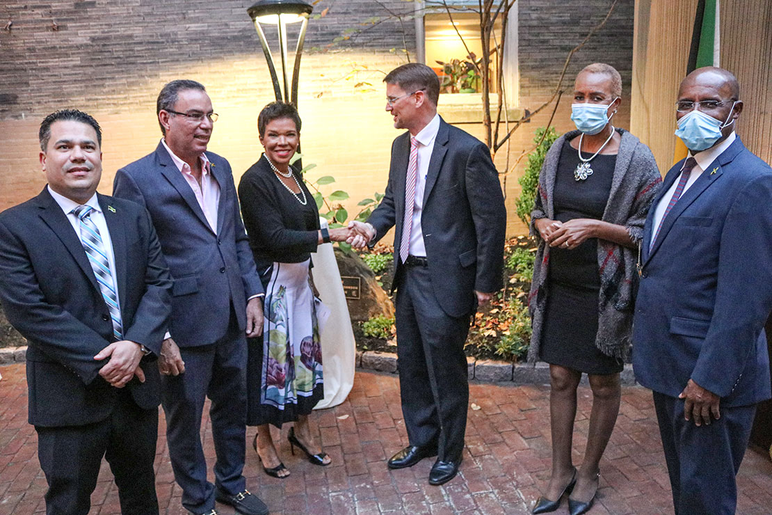 Jamaica’s Ambassador to the United States Her Excellency Audrey Marks greets the Assistant Secretary of State for the Caribbean, Mr. Mark Wells as he arrives at the Embassy of Jamaica to attend a reception marking the conclusion of consultations on ICT, cyber security, and energy between the governments of Jamaica and the United States on Friday at the Embassy of Jamaica in Washington DC. On hand to greet the Assistant Secretary are Minister without Portfolio in the Ministry of National Security Senator Matthew Samuda; Delegation head, Science, Energy and Technology Minister Hon. Daryl Vaz; Education and Information Minister Hon. Faval Williams; and Minister without Portfolio in the Ministry of Economic Growth and Job Creation, Senator Aubyn Hill. Derrick Scott Photo