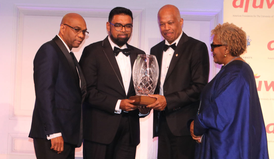 President of Guyana His Excellency Dr. Mohamed Irfaan Ali accepts the Legacy Award from Vice Chancellor of the University of the West Indies from Professor Hilary Beckles at the American Foundation for The University of the West Indies annual gala in Manhattan on Thursday April 18, 2024.At Left is AFUWI Board member Dr. Ron Chase, while at right is Guyanese-American actress CCH Pounder.