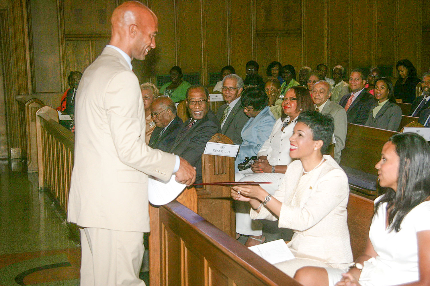 Jamaica’s ambassador to the United States, Her Excellency Audrey Marks, accepts a scroll proclaiming August 6 as “Jamaica’s Independence Day in Washington DC,” from Washington DC forma Mayor Adrian Fenty during the Jamaican Independence Service of Thanksgiving at Howard University’s Dumbarton Chapel. At right in Mrs. Michelle Fenty (PHOTO Derrick Scott)
