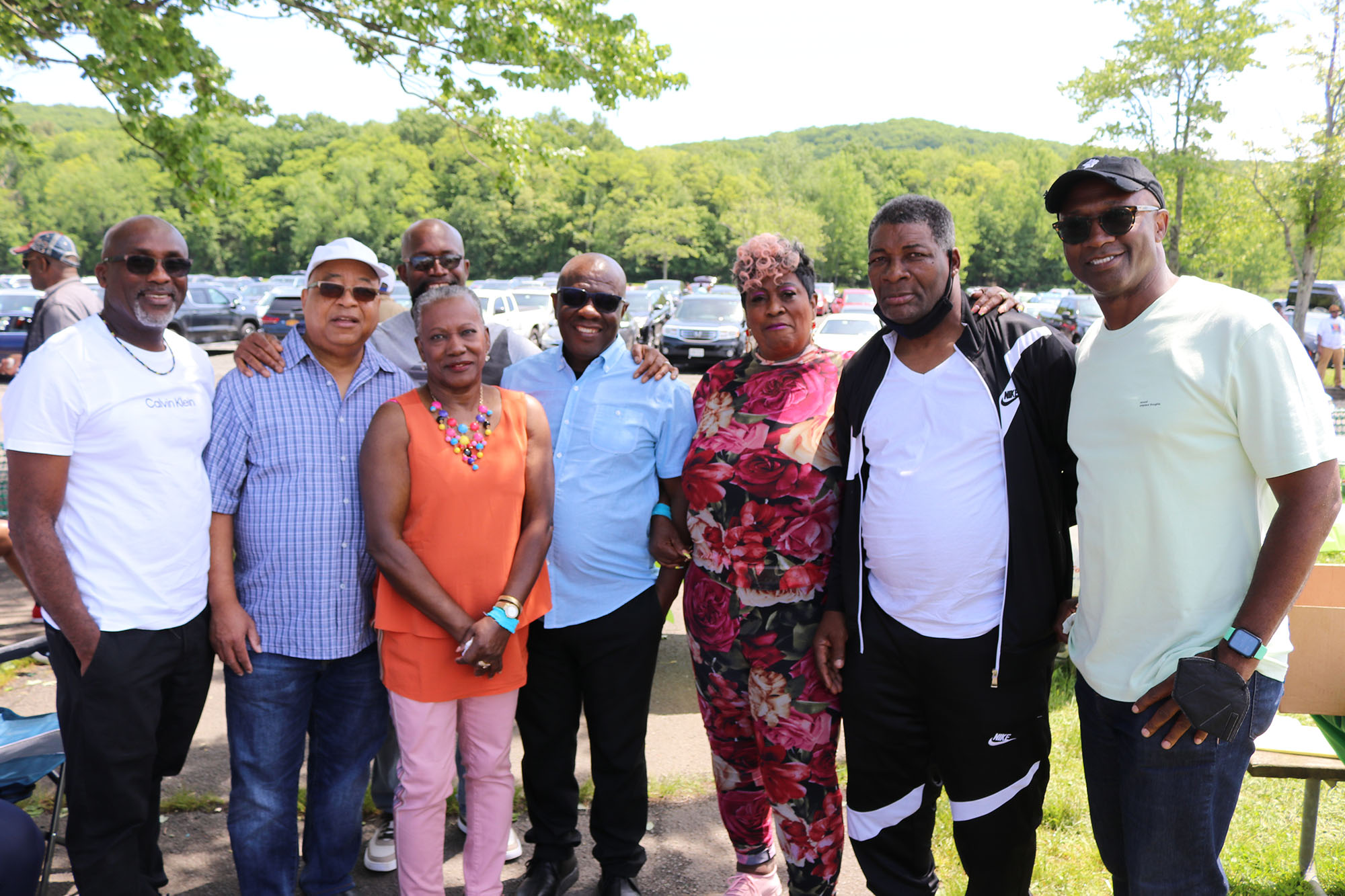 Falmouth’s Mayor Colin Gager (center) shares a light moment with fellow Trelawny parishioners. From left Kenneth Bailey Charles Ramdatt Alinthi Allwood Gallagher Violet Johnson Tomlin Anderson Harry Peter Johnson and Loyal Ellis Occasion was the annual Trelawny Picnic at the Rockland County State Park in Nyack, New York, on Sunday, May 29. (DERRICK SCOTT photo)