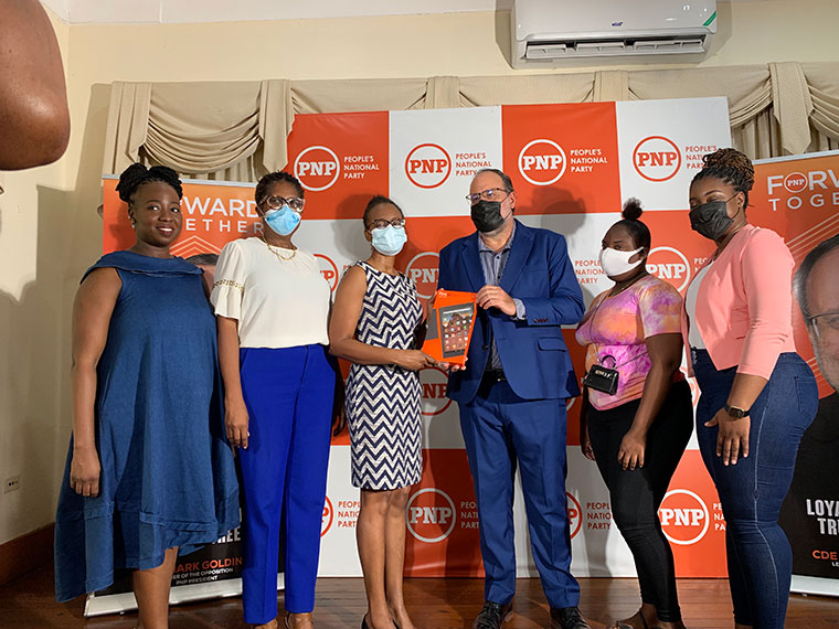Party President Mark J. Golding presented the first tablet to the Director of Business Development at the Jamaica Association for the Deaf, Deniese Badroe, to signal the official start of the campaign.