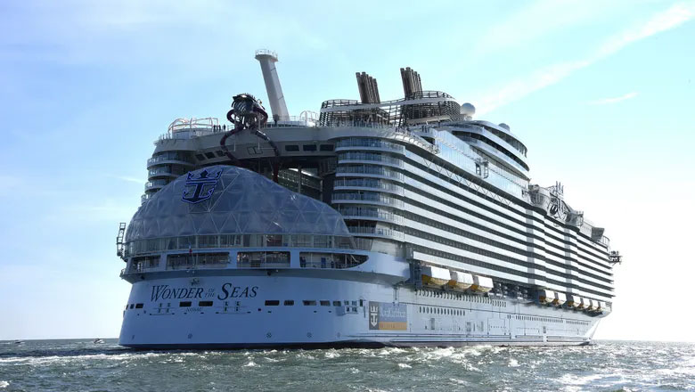 Royal Caribbean's Wonder of the Seas is currently the largest cruise ship in the world, taking the title from her sister ship Symphony of the Seas. At 1,188 feet long, 210 feet wide, and with a gross tonnage of 236,857, Wonder of the Seas is a massive vessel. She has a capacity of 5,734 guests at double capacity and 6,988 guests total. With 2,300 crew onboard, the total capacity for Wonder of the Seas is 9,288 passengers!