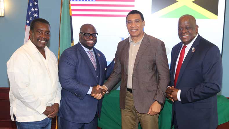 Prime Minister Andrew Holness receives a warm welcome from The President of Delaware State University Dr. Tony Allen as he arrives at the University on Thursday to attend a luncheon given in his honour by the University. Sharing in the occasion at left is Member of Parliament for St, mary Western, Robert Montague and senior vice president for DSU Antonio Boyle | Derrick Scott Photo.