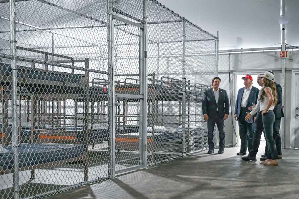 President Donald Trump (second from left), Florida Governor Ron DeSantis (L), and Secretary of Homeland Security Kristi Noem (R) tour a migrant detention center, dubbed "Alligator Alcatraz," located at the site of the Dade-Collier Training and Transition Airport in Ochopee, Fla. on July 1, 2025. Andrew Caballero-Reynolds/AFP via Getty Images