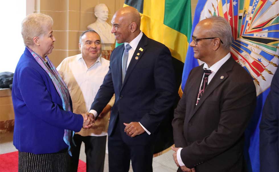 Ambassador Anthony Anderson, receives congratulations from Mexico’s Permanent Representative to the OAS, H.E. Luz Elena Baños Rivas. Sec. Gen. Albert Ramdin and OAS Assistant Secretary General Nestor Mendez look on.  Photo Derrick Scott.
