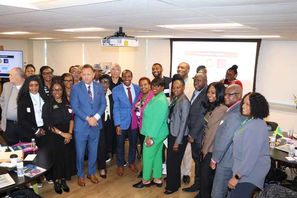 Minister of State in the Ministry of Foreign Affairs and Foreign Trade, with responsibility for diaspora affairs, Hon. Alando N. Terrelonge, Center poses for a group photograph with participants at the second Jamaica Diaspora Northeast USA Conference at Temple University in Philadelphia, Pennsylvania, on Friday, October 23, 2026. Photo by Derrick Scott.