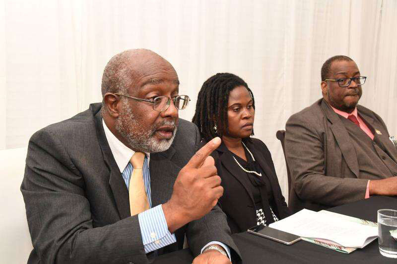 Member of Parliament for St Catherine Southern Fitz Jackson (left) tells the media about his law suit against The Bank of Nova Scotia Jamaica Limited. Beside him are his attorneys Annette Henry and Anthony Williams. The press conference was held at Spanish Court Hotel in New Kingston on Tuesday July 26, 2022.