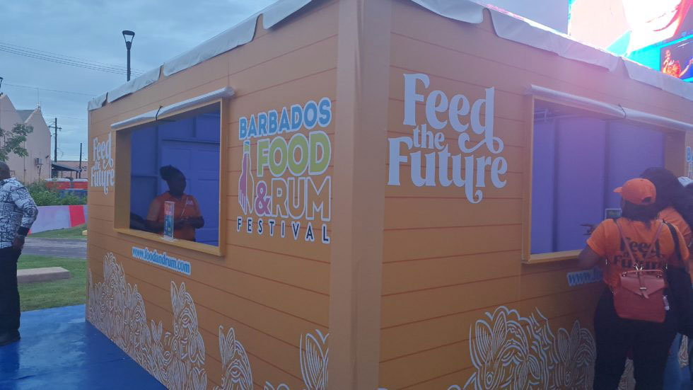 Booth selling branded Food and Rum Festival gear such as aprons, tumblers and hats. (A.Reid/BGIS)