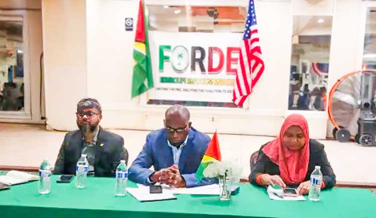 Roysdale Forde SC, MP with former Mayor Pt. Ubraj Narine at left ,and Natasha Singh Lewis MP (right) at a Town hall meeting at Woodbine Ballroom, Brooklyn N.Y on May 10, 2024