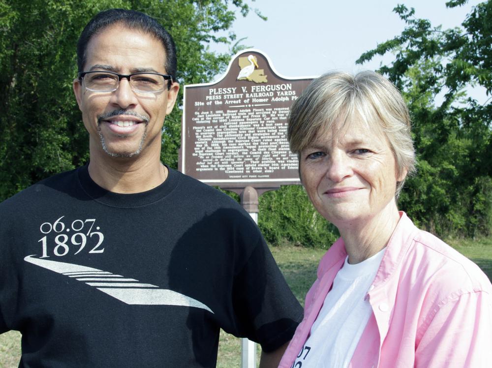 Keith Plessy and Phoebe Ferguson, descendants of the principals in the Plessy V. Ferguson court case, pose for a photograph in front of a historical marker in New Orleans, on Tuesday, June 7, 2011. Homer Plessy, the namesake of the U.S. Supreme Court's 1896 "separate but equal" ruling, was granted a posthumous pardon, Wednesday, Jan. 5, 2022. The Creole man of color died with a conviction still on his record for refusing to leave a whites-only train car in New Orleans in 1892. (AP Photo/Bill Haber, File)