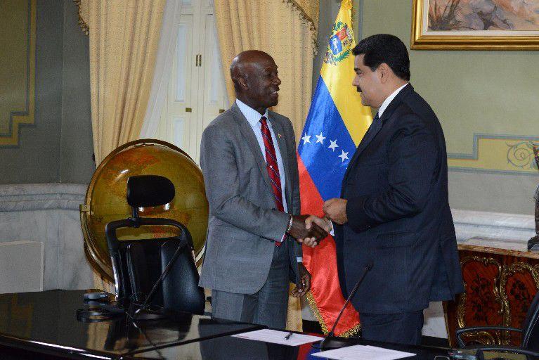  Prime Minister Dr Keith Rowley, left, and Venezuelan President Nicolas Maduro shake hands following a joint media conference at the Presidential Palace on in Caracas, Venezuela. PM Rowley had earlier signed an agreement to share gas blocks. —Photo: ISHMAEL SALANDY