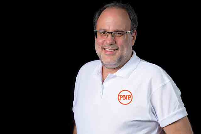 People's National Party President Mark Golding assisted in purchasing train tickers for the students