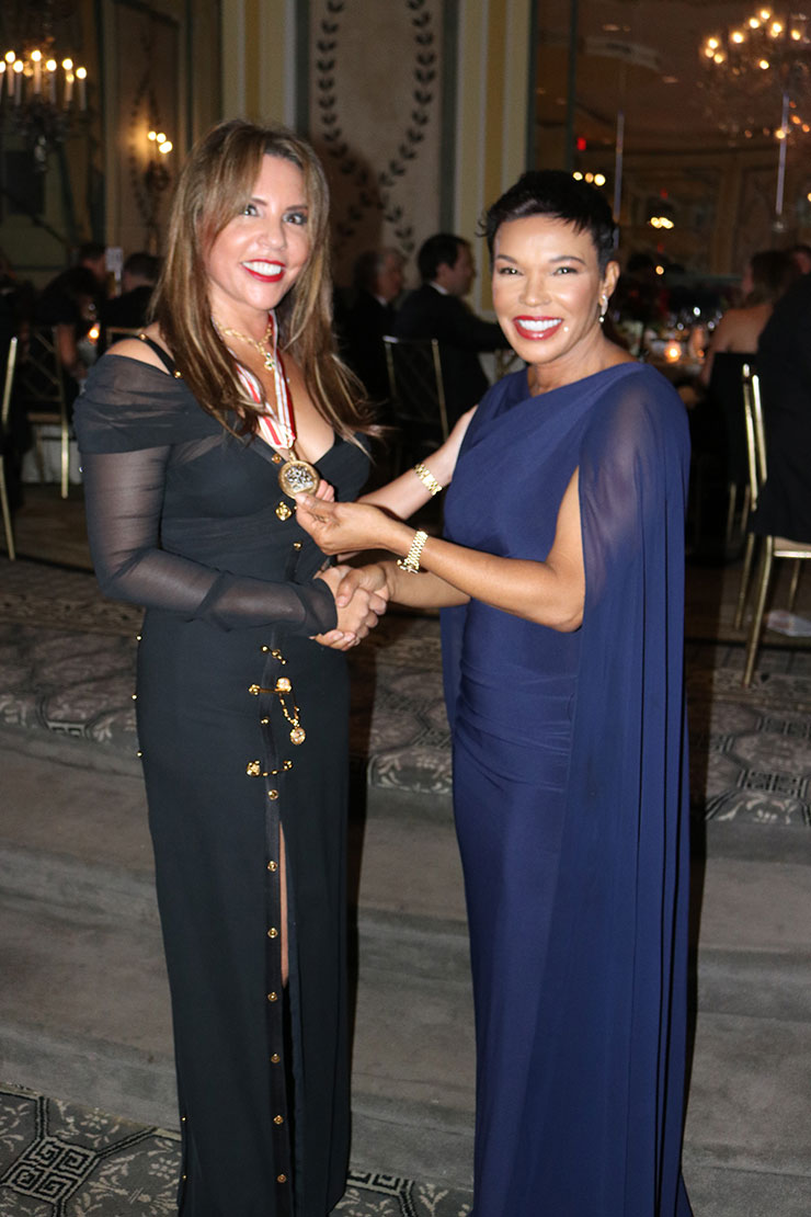 Jamaica’s Ambassador to the United States  Audrey Marks (right) congratulates Ambassador for Investment and Philanthropy, Mrs. Paula Kerr Jarret Wegman on receiving the prestigious Commonwealth Award from the St. George’s Society of  New York at its annual English Ball on Tuesday October  26, at the St. Pierre Hotel in Manhattan .|Photo by Derrick Scott.