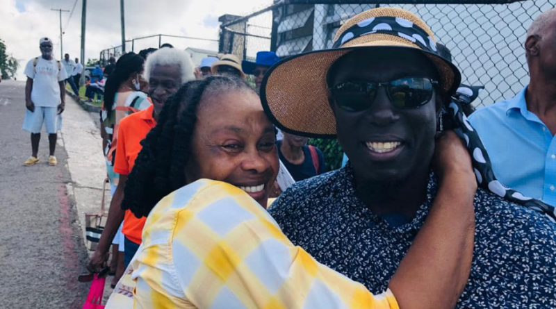 Jamale Pringle being hugged by a constituent