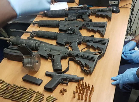 Lottery scammers use money swindled from American victims to purchase guns and ammunition for their criminal activities Photos courtesy of JCF