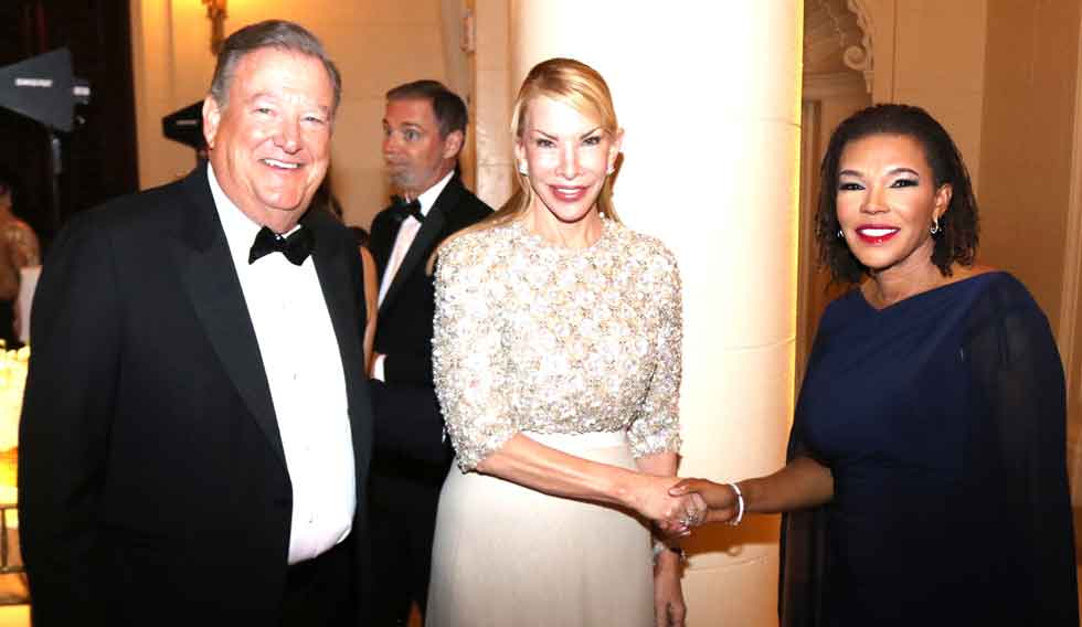 Minister in the Office of the Prime Minister with responsibility for Efficiency, Innovation and Digital Transformation, Ambassador Audrey Marks right is greeted by Tree of Life Foundation Founder and President Amanda Schumacher as she arrives at the Foundation International awards glittering ceremony held last evening at the upscale Breakers Palm Beach Resort in Florida. Looking is Mr. Charles Schumacher. PHOTO Derrick Scott.