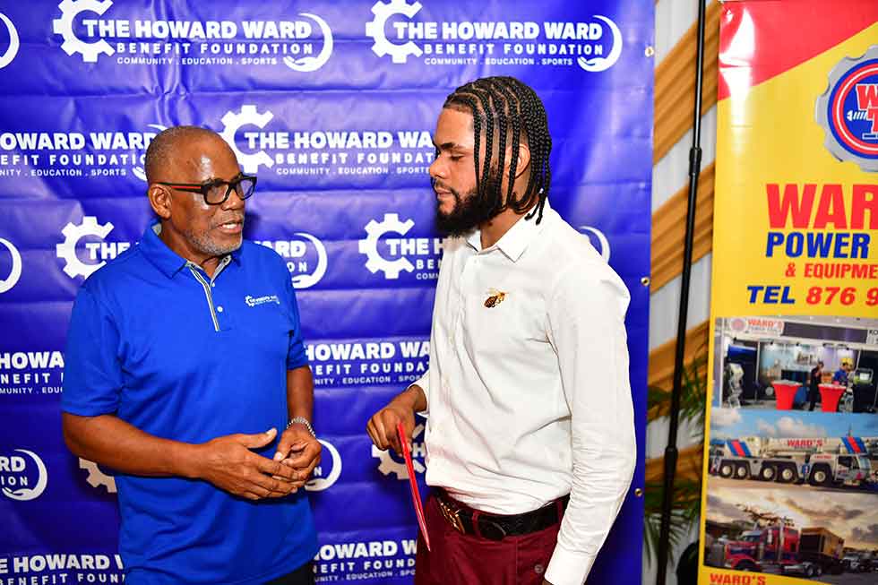 Chairman of Howard Ward's Benefit Foundation & Managing Director of Wards Power Tools, Mr. Howard Ward in an engaging discussion with Raddai Eccleston, returning scholar who is pursuing dentistry at the University of Technology in Kingston (UTECH) | Aceon Cunningham Photo.