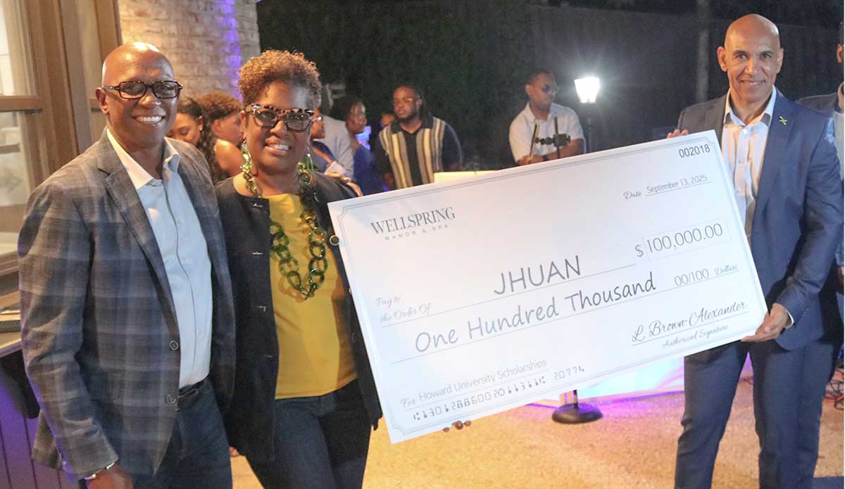 Ambassador Major General (Ret’d) Antony Anderson (right), receives a check for a US$100.00 from Lisa Brown Alexander, second left a Howard alum and owner of Wellspring Manor & Spa in Silver Spring, Maryland on behalf of Jamaica Howard University Affinity Network (JHUAN).